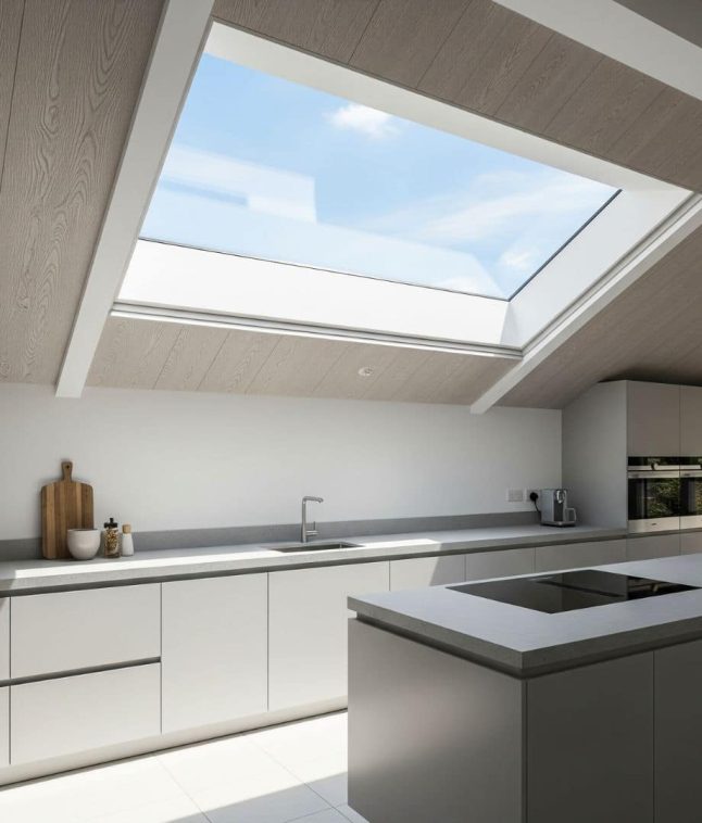 Triple glazed rooflight in a pitched roof, bringing in light for a contemporary kitchen