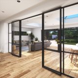 Open glass partition doors connecting to the living room with two rooflights in the ceiling