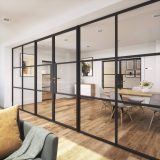 Modern dining room with glass partition walls