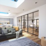 Roof lights shining into living room with glass partition into the dining room